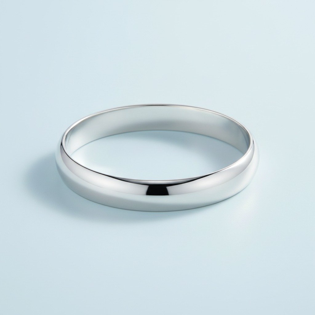 Smooth Oval Bangle — A continuous smooth oval wrist band with no clasp.
